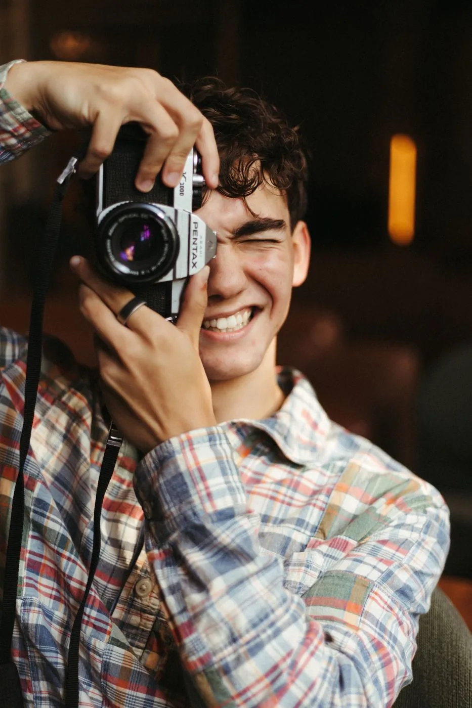 HardeeImagery photographer holding a film camera