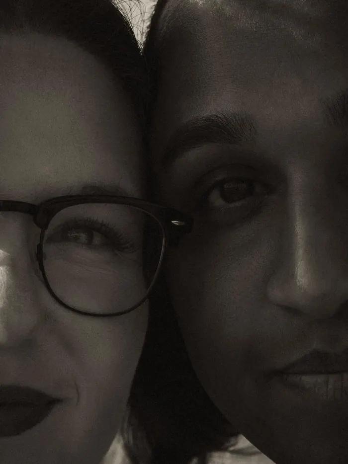 Black and white close-up of a couple cheek to cheek